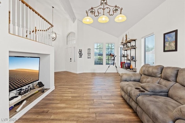 741 Wildwood Beach Ave, Henderson, NV 89052 - living room featuring wood finished floors, high vaulted ceiling, and a chandelier