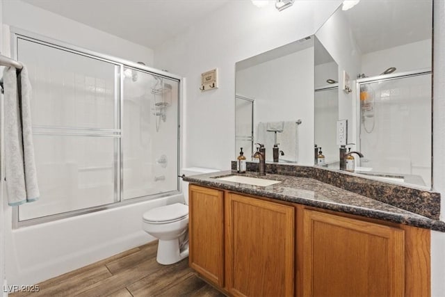 741 Wildwood Beach Ave, Henderson, NV 89052 - bathroom featuring vanity, enclosed tub / shower combo, and wood finished floors