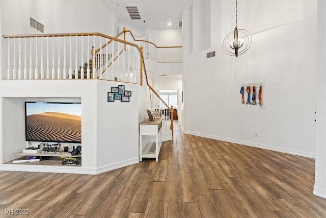 741 Wildwood Beach Ave, Henderson, NV 89052 - entrance foyer with stairs, wood finished floors, a high ceiling, and a chandelier
