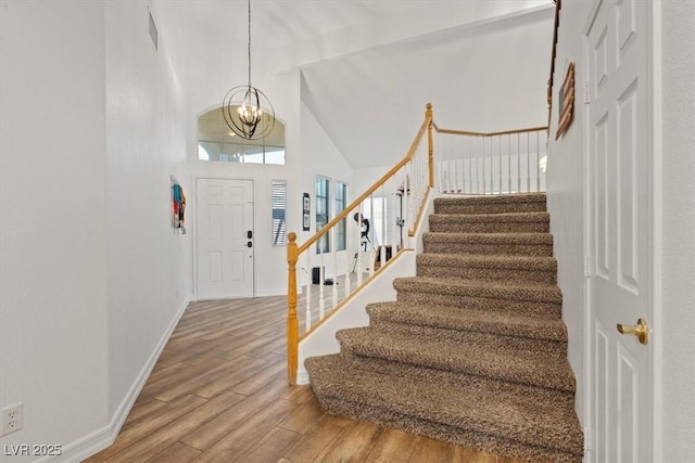 741 Wildwood Beach Ave, Henderson, NV 89052 - entryway with wood finished floors, stairs, a chandelier, and high vaulted ceiling