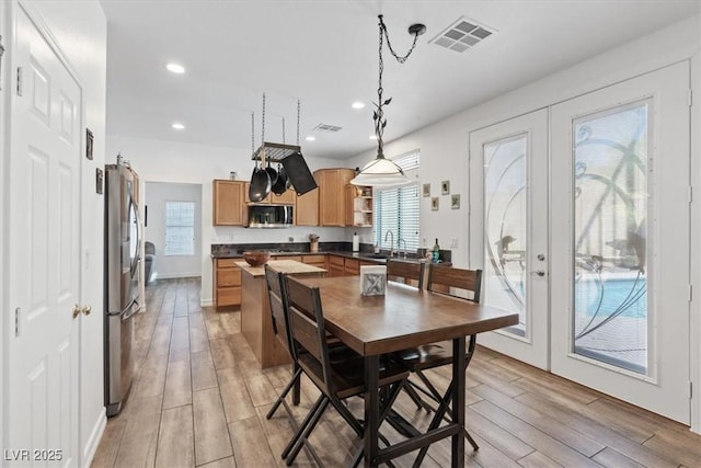 741 Wildwood Beach Ave, Henderson, NV 89052 - dining area with french doors, light wood finished floors, and recessed lighting