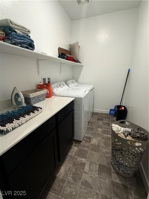1618 Dakota Group Ave, North Las Vegas, NV 89084 - washroom featuring washer and dryer, cabinet space, and stone finish floors
