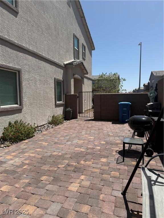 1618 Dakota Group Ave, North Las Vegas, NV 89084 - view of patio with a gate and a grill
