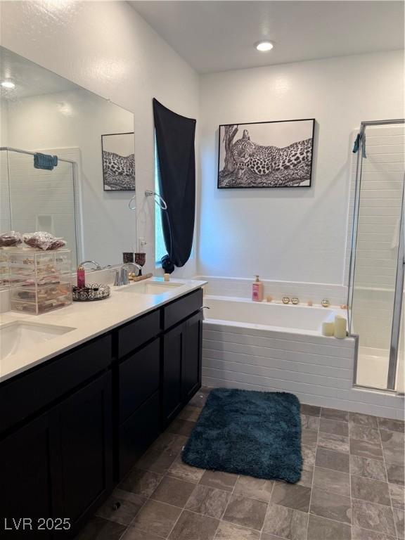 1618 Dakota Group Ave, North Las Vegas, NV 89084 - bathroom featuring a bath, a shower stall, and double vanity
