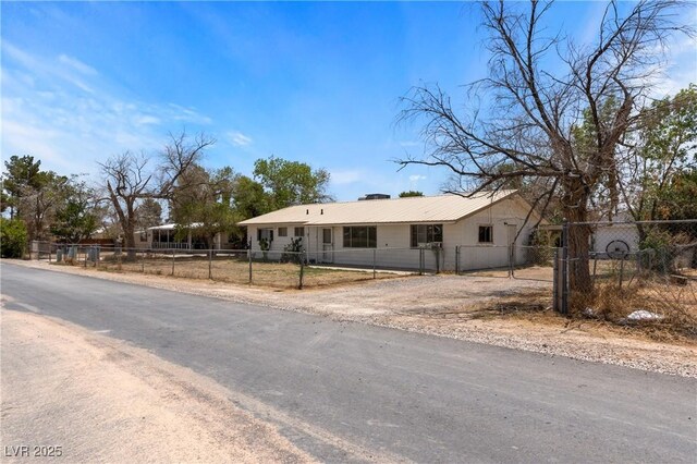 585 W Ingram Ave, Overton, NV 89040 - ranch-style home with a fenced front yard and a metal roof
