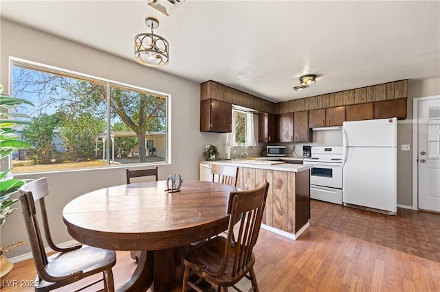 585 W Ingram Ave, Overton, NV 89040 - dining space with dark wood finished floors and healthy amount of natural light