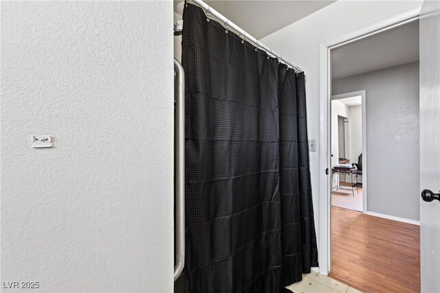 585 W Ingram Ave, Overton, NV 89040 - full bath featuring baseboards and curtained shower