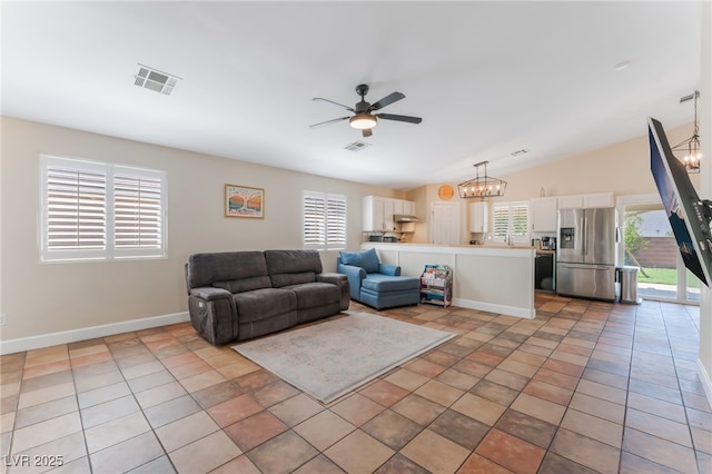 4837 River Splash Ave, Las Vegas, NV 89131 - living area with ceiling fan, a chandelier, and vaulted ceiling
