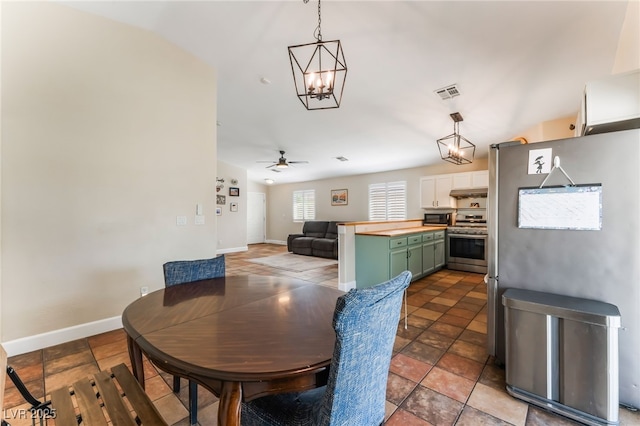 4837 River Splash Ave, Las Vegas, NV 89131 - dining area with a chandelier and a ceiling fan