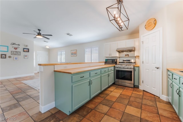 4837 River Splash Ave, Las Vegas, NV 89131 - kitchen featuring appliances with stainless steel finishes, green cabinetry, wooden counters, and white cabinets
