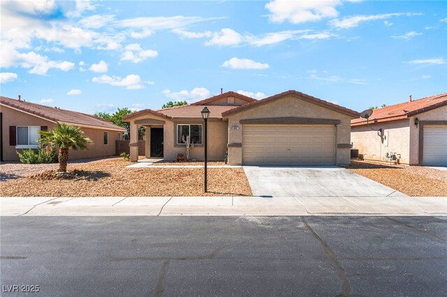 4837 River Splash Ave, Las Vegas, NV 89131 - single story home with an attached garage, driveway, stucco siding, and a tiled roof