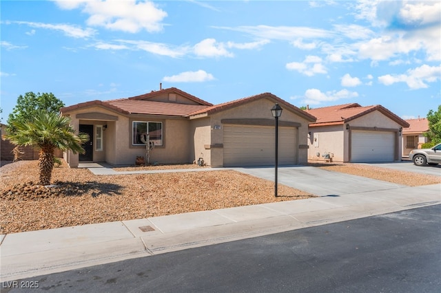 4837 River Splash Ave, Las Vegas, NV 89131 - ranch-style home featuring stucco siding, a tiled roof, a garage, and concrete driveway