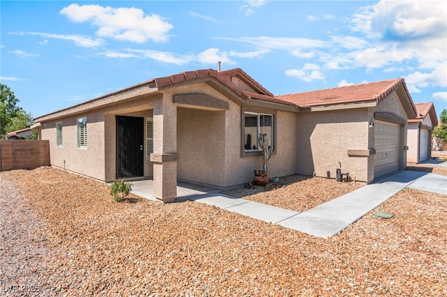 4837 River Splash Ave, Las Vegas, NV 89131 - ranch-style house with a garage, stucco siding, and a tile roof