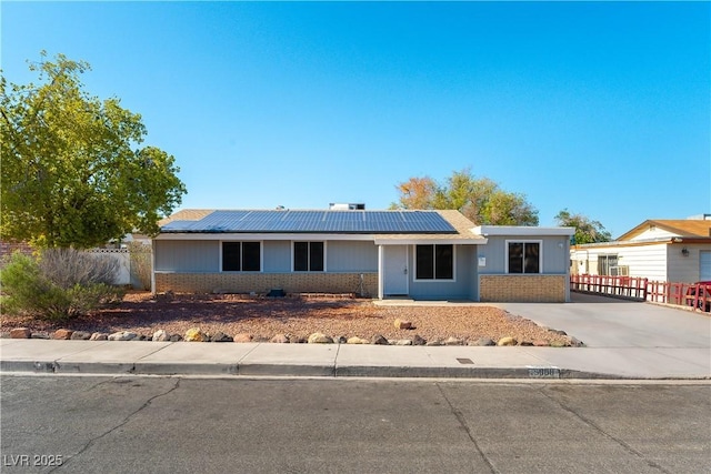 5800 Auborn Ave, Las Vegas, NV 89108 - single story home with brick siding and roof mounted solar panels