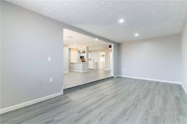 5800 Auborn Ave, Las Vegas, NV 89108 - unfurnished living room featuring light wood finished floors, recessed lighting, and ceiling fan