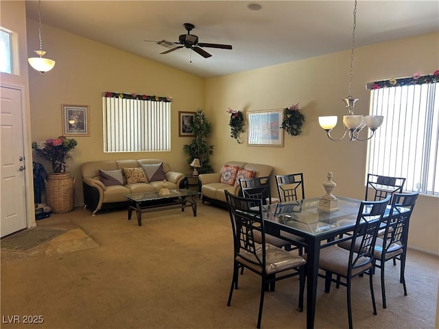 4620 Ventana Rey St, North Las Vegas, NV 89081 - dining area with light colored carpet, ceiling fan, vaulted ceiling, and a chandelier