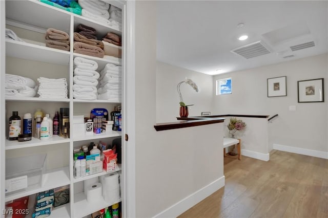 530 Sonoma Range St, Las Vegas, NV 89138 - hall with wood finished floors and an upstairs landing