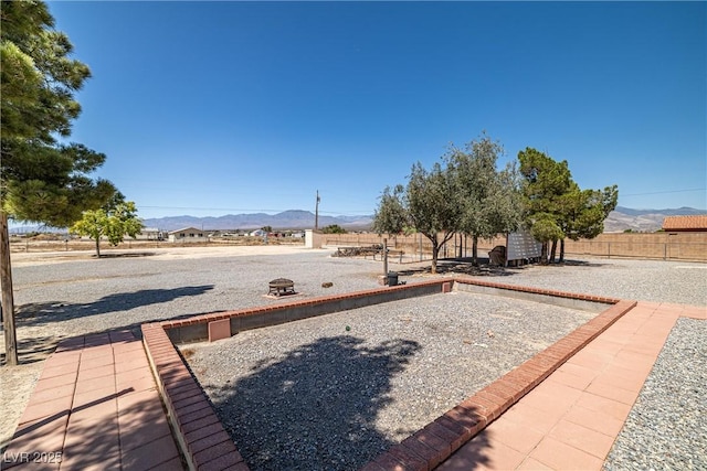 2730 Banyon St, Pahrump, NV 89048 - view of yard with a game area and a mountain view