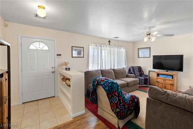 2730 Banyon St, Pahrump, NV 89048 - living area featuring plenty of natural light and a ceiling fan