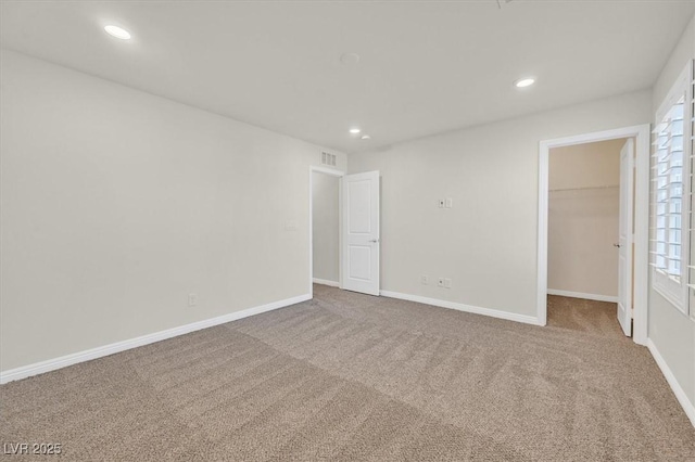 9327 Ettrick Ct, Las Vegas, NV 89178 - unfurnished bedroom with a spacious closet, carpet floors, recessed lighting, and a closet