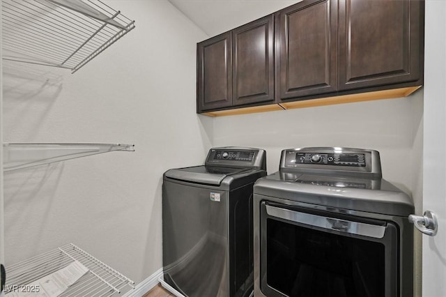 9327 Ettrick Ct, Las Vegas, NV 89178 - washroom featuring cabinet space and washer and clothes dryer