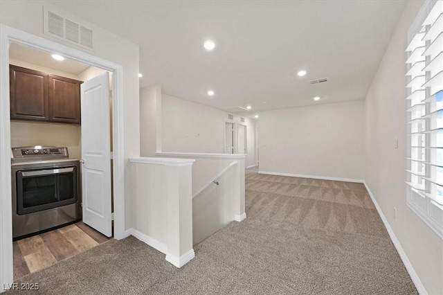 9327 Ettrick Ct, Las Vegas, NV 89178 - corridor with washer / dryer, light colored carpet, an upstairs landing, and recessed lighting
