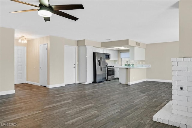 808 Vermillion Dr, Henderson, NV 89002 - unfurnished living room featuring dark wood finished floors and ceiling fan