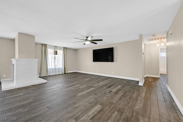 808 Vermillion Dr, Henderson, NV 89002 - unfurnished living room with dark wood-style flooring and a ceiling fan