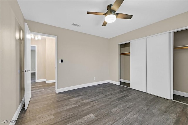 808 Vermillion Dr, Henderson, NV 89002 - unfurnished bedroom featuring dark wood-style floors, a closet, and a ceiling fan