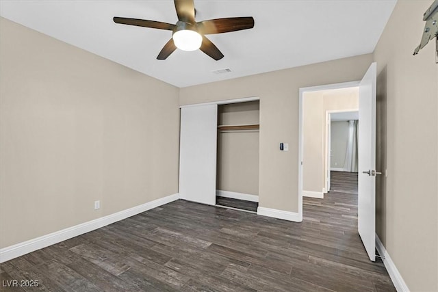 808 Vermillion Dr, Henderson, NV 89002 - unfurnished bedroom with dark wood-type flooring, a closet, and ceiling fan