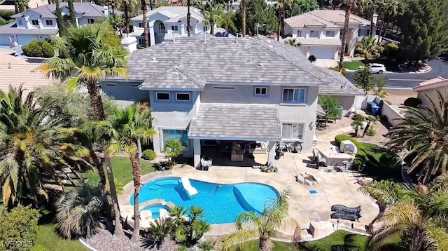 9905 Fox Springs Dr, Las Vegas, NV 89117 - view of pool featuring a pool with connected hot tub, a patio, and a residential view