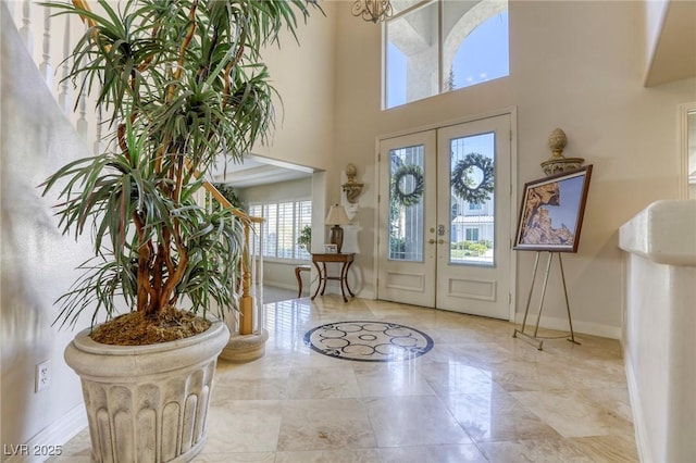 9905 Fox Springs Dr, Las Vegas, NV 89117 - foyer with french doors, marble tiled flooring, and a towering ceiling