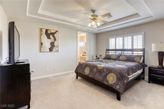 9905 Fox Springs Dr, Las Vegas, NV 89117 - bedroom featuring a tray ceiling, carpet, connected bathroom, and ceiling fan