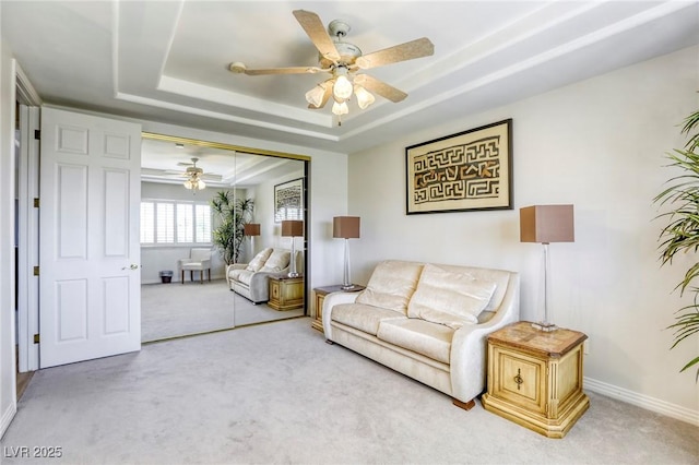 9905 Fox Springs Dr, Las Vegas, NV 89117 - living area featuring a raised ceiling, carpet, and a ceiling fan