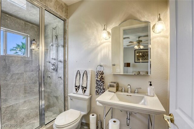 9905 Fox Springs Dr, Las Vegas, NV 89117 - full bathroom with a stall shower and a ceiling fan