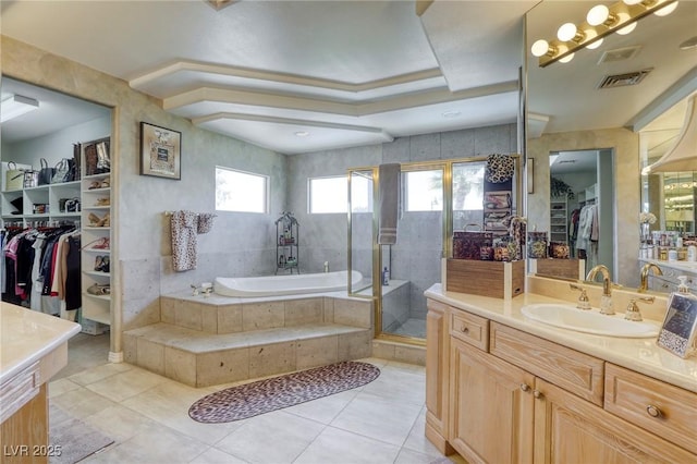 9905 Fox Springs Dr, Las Vegas, NV 89117 - full bath with plenty of natural light, vanity, a bath, and a walk in closet
