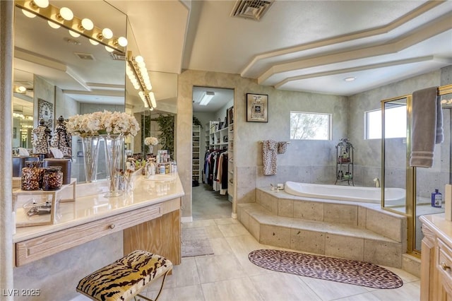 9905 Fox Springs Dr, Las Vegas, NV 89117 - full bathroom with vanity, a bath, tile patterned flooring, and a spacious closet
