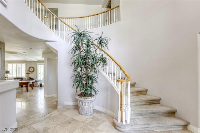 9905 Fox Springs Dr, Las Vegas, NV 89117 - staircase featuring baseboards and a high ceiling