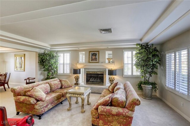 9905 Fox Springs Dr, Las Vegas, NV 89117 - carpeted living area featuring a raised ceiling and a fireplace