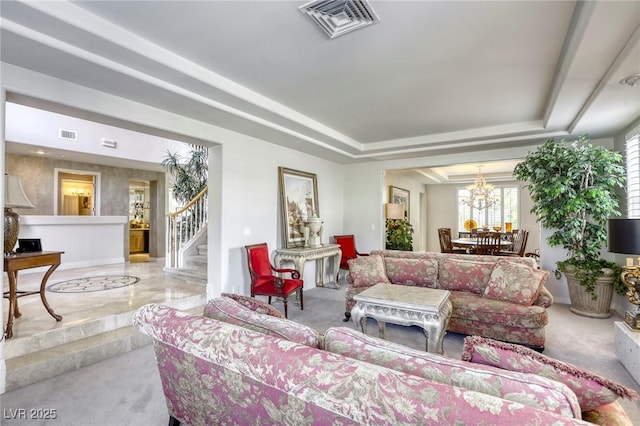 9905 Fox Springs Dr, Las Vegas, NV 89117 - living room featuring carpet flooring, a chandelier, a tray ceiling, and stairs