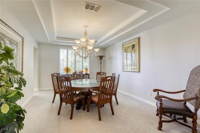 9905 Fox Springs Dr, Las Vegas, NV 89117 - dining space featuring a raised ceiling, a chandelier, and light carpet