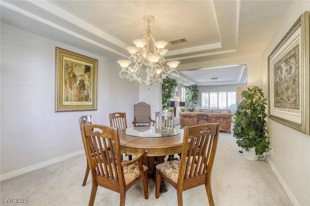 9905 Fox Springs Dr, Las Vegas, NV 89117 - dining space with a chandelier, light carpet, and a raised ceiling