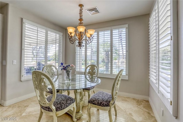 9905 Fox Springs Dr, Las Vegas, NV 89117 - tiled dining space featuring a chandelier and baseboards