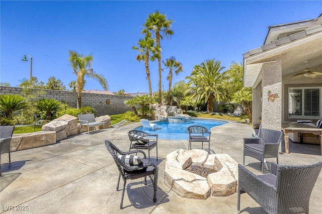 9905 Fox Springs Dr, Las Vegas, NV 89117 - fenced backyard with a fire pit, ceiling fan, and a patio area