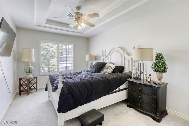 9905 Fox Springs Dr, Las Vegas, NV 89117 - bedroom featuring light colored carpet, a tray ceiling, and ceiling fan
