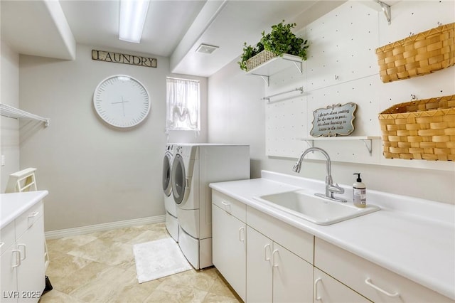 9905 Fox Springs Dr, Las Vegas, NV 89117 - laundry area with washing machine and clothes dryer and cabinet space