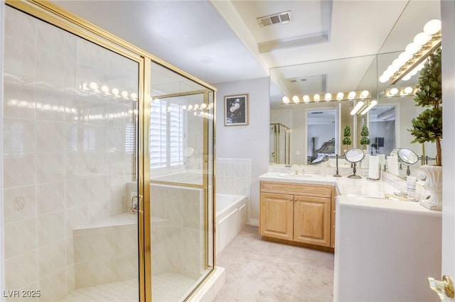 9905 Fox Springs Dr, Las Vegas, NV 89117 - full bathroom featuring vanity, a garden tub, and a shower stall