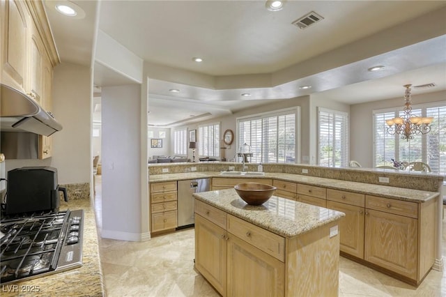 9905 Fox Springs Dr, Las Vegas, NV 89117 - kitchen featuring appliances with stainless steel finishes, light brown cabinetry, a center island, recessed lighting, and light stone countertops