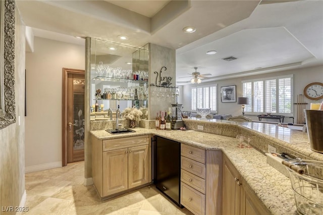 9905 Fox Springs Dr, Las Vegas, NV 89117 - indoor wet bar featuring recessed lighting, fridge, a ceiling fan, and a tray ceiling