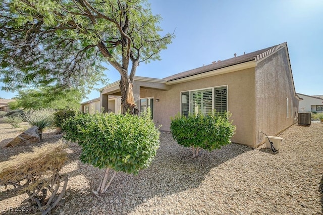 7916 Lyrebird Dr, North Las Vegas, NV 89084 - view of home's exterior featuring a central AC unit and stucco siding